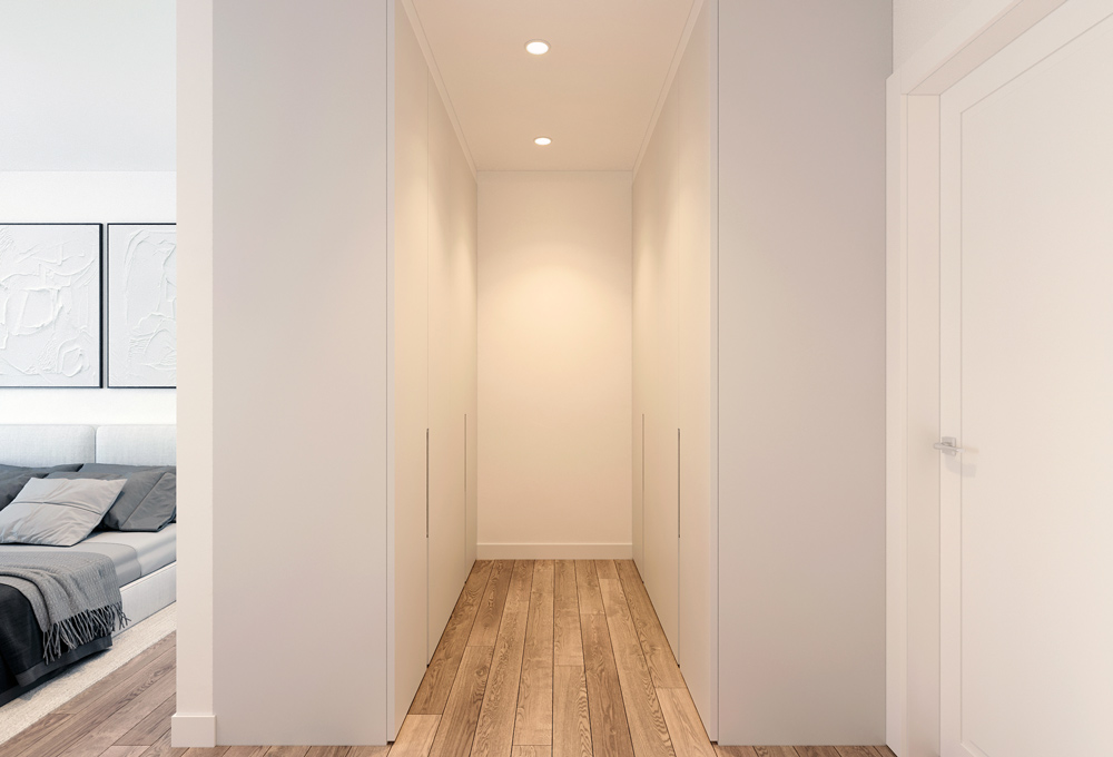 Schmaler Flur in einer Wohnung im Quartier Am Kliff, führt zum stilvoll eingerichteten Schlafzimmer mit moderner Beleuchtung