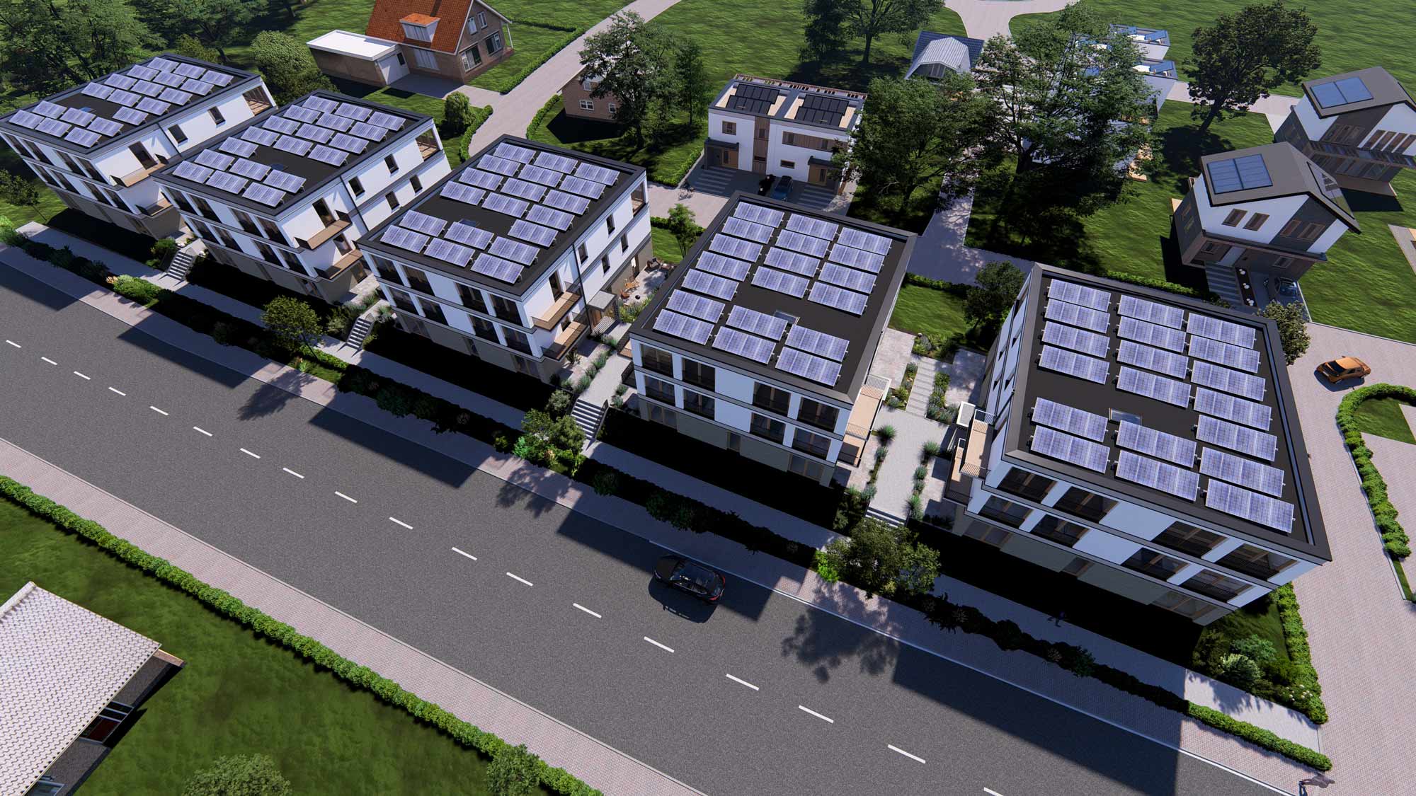 Luftaufnahme der Gebäude im Quartier Am Kliff mit Solaranlagen auf den Dächern, zeigt die nachhaltige Energieversorgung