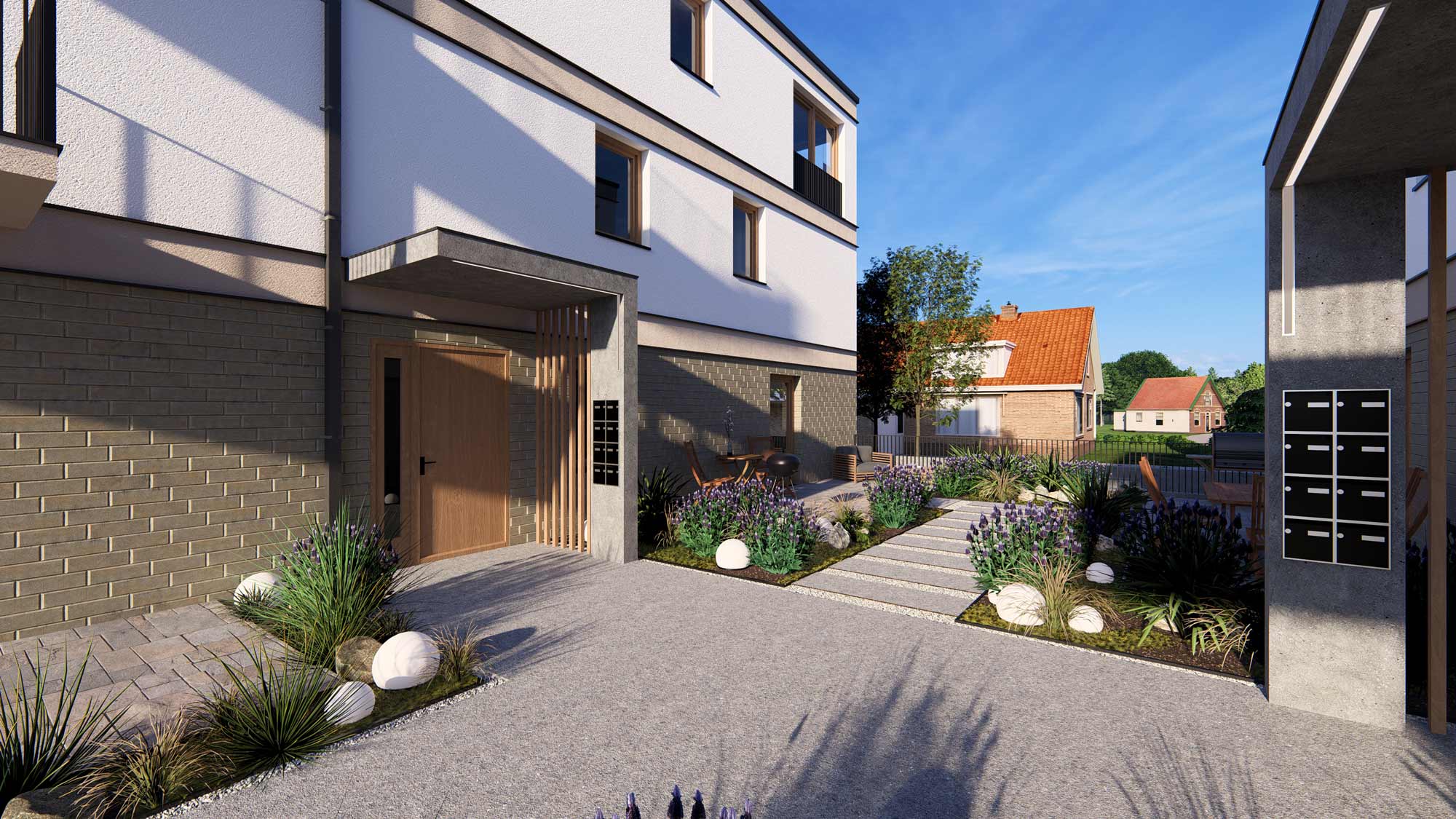 Eingangsbereich des Quartier Am Kliff mit gepflegter Gartenanlage, modernen Gebäuden und Häusern im Hintergrund an einem sonnigen Tag