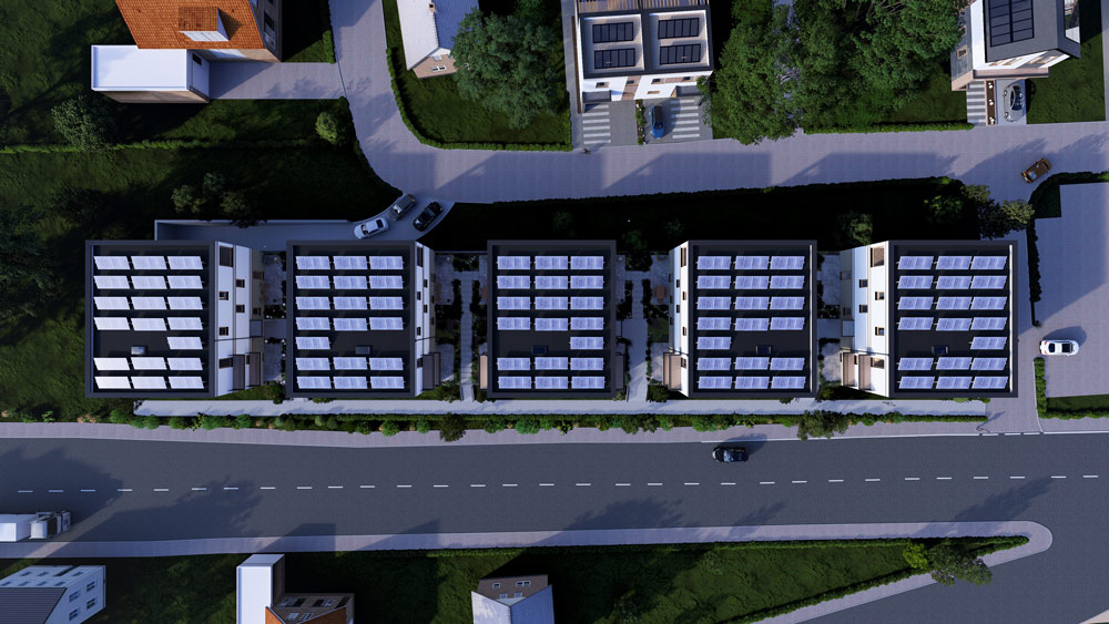 Luftaufnahme des Quartier Am Kliff, zeigt die Anordnung der Gebäude entlang der Straße und deren Umgebung